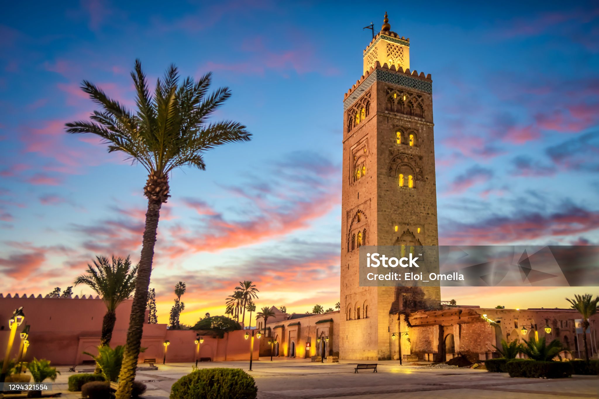 Koutoubia mosque in the morning surrounded by palm tree, Marrakesh, Morocco